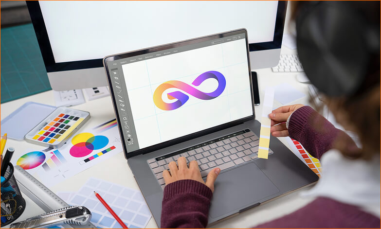 Woman designing logo on laptop